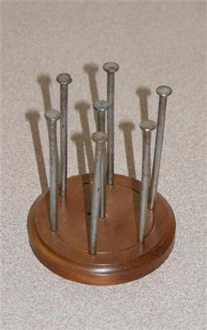 Nail problem. Balance the 6 outer nails on top of the middle nail.Ask Howard